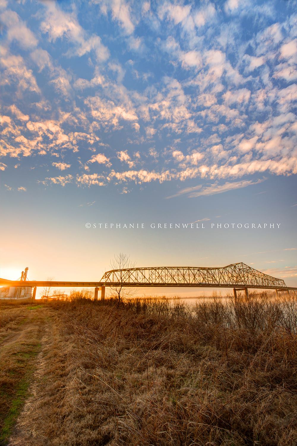 mississippi river bridge sunset landscape tennessee clouds southeast missouri photographer stephanie greenwell