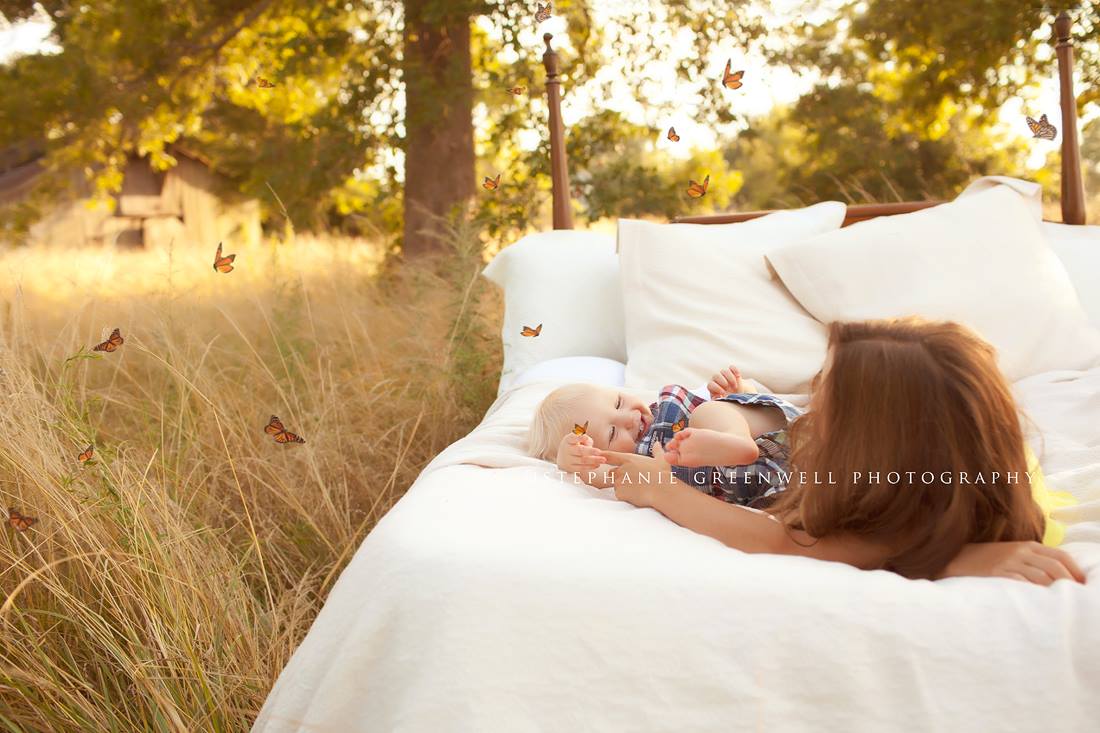 whimsical butterflies children in field on bed playing southeast missouri photographer stephanie greenwell